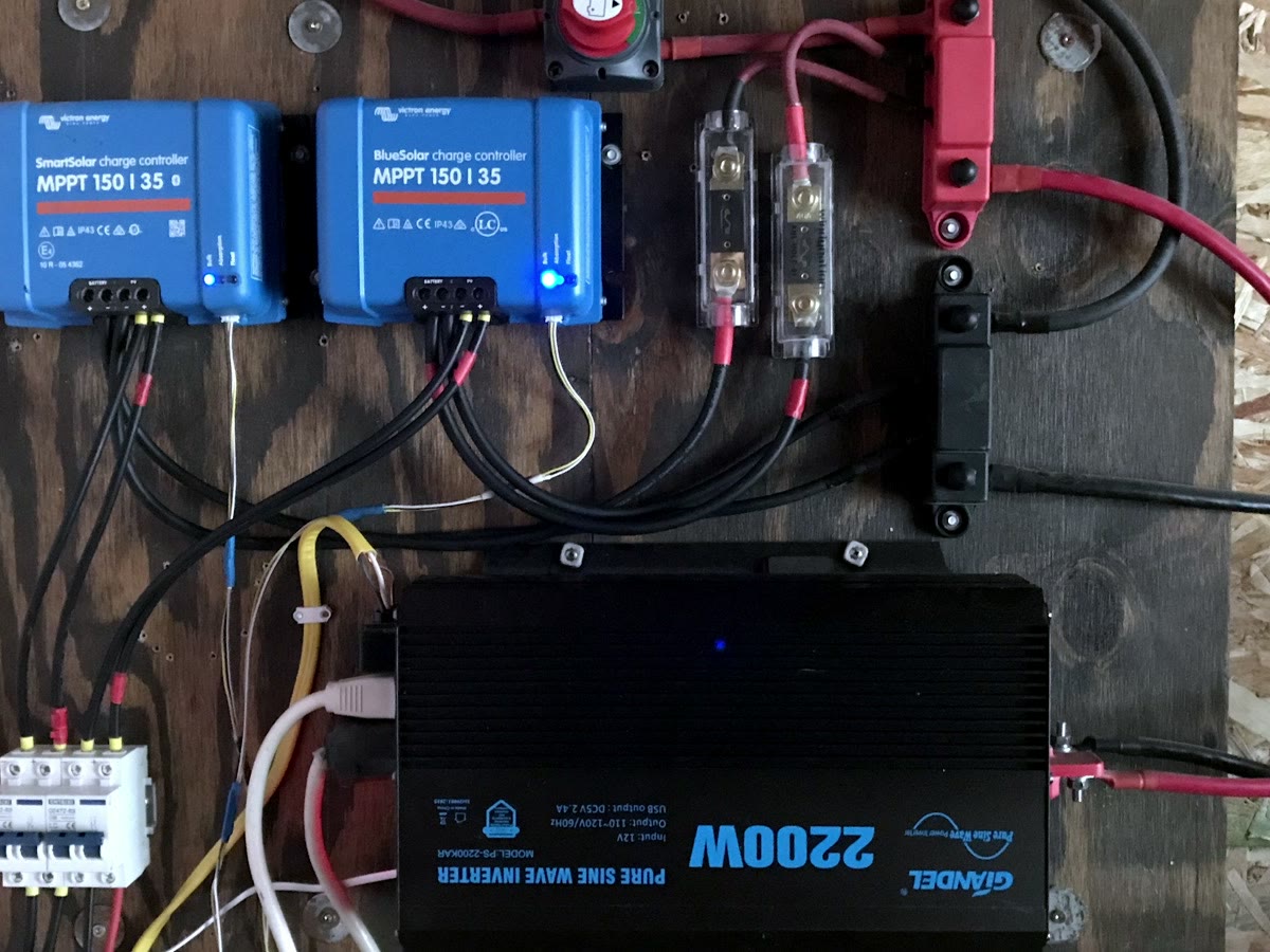 12V solar wall with two Victron SmartSolar charge controllers and a 2200W inverter