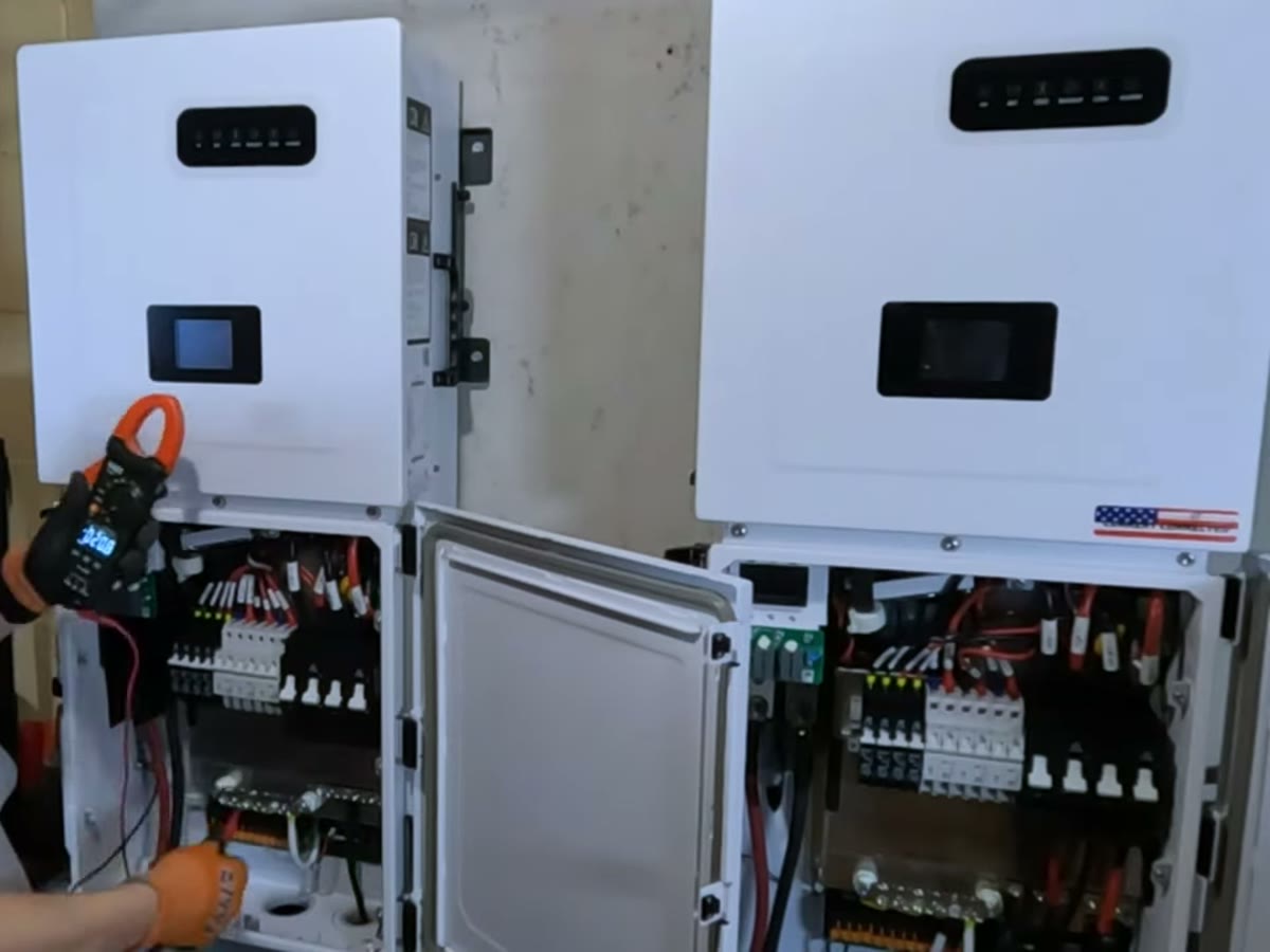 Adam testing two paralleled MidNite Solar TheOne inverters with a clamp meter